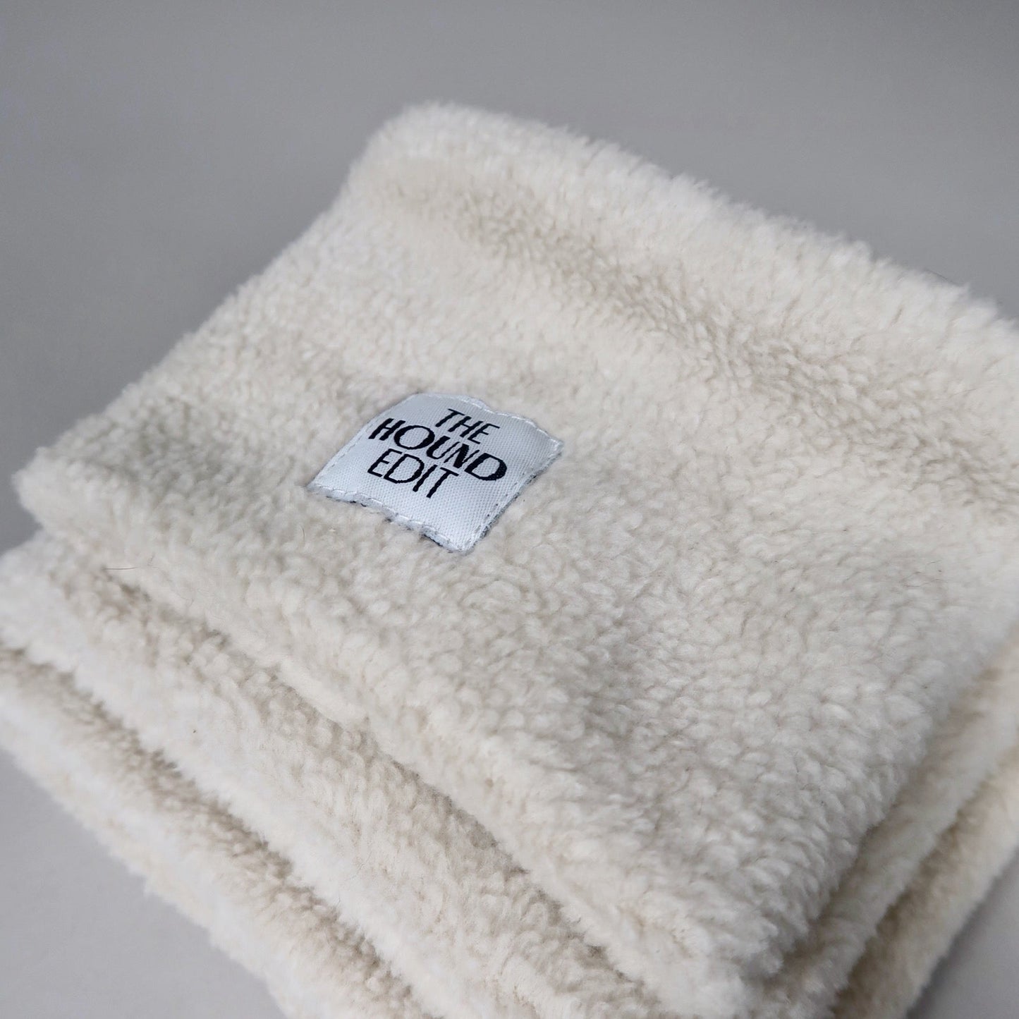 Stacked close-up from above of The Rue, Sighthound 100% cotton snoods, across the three sizes.