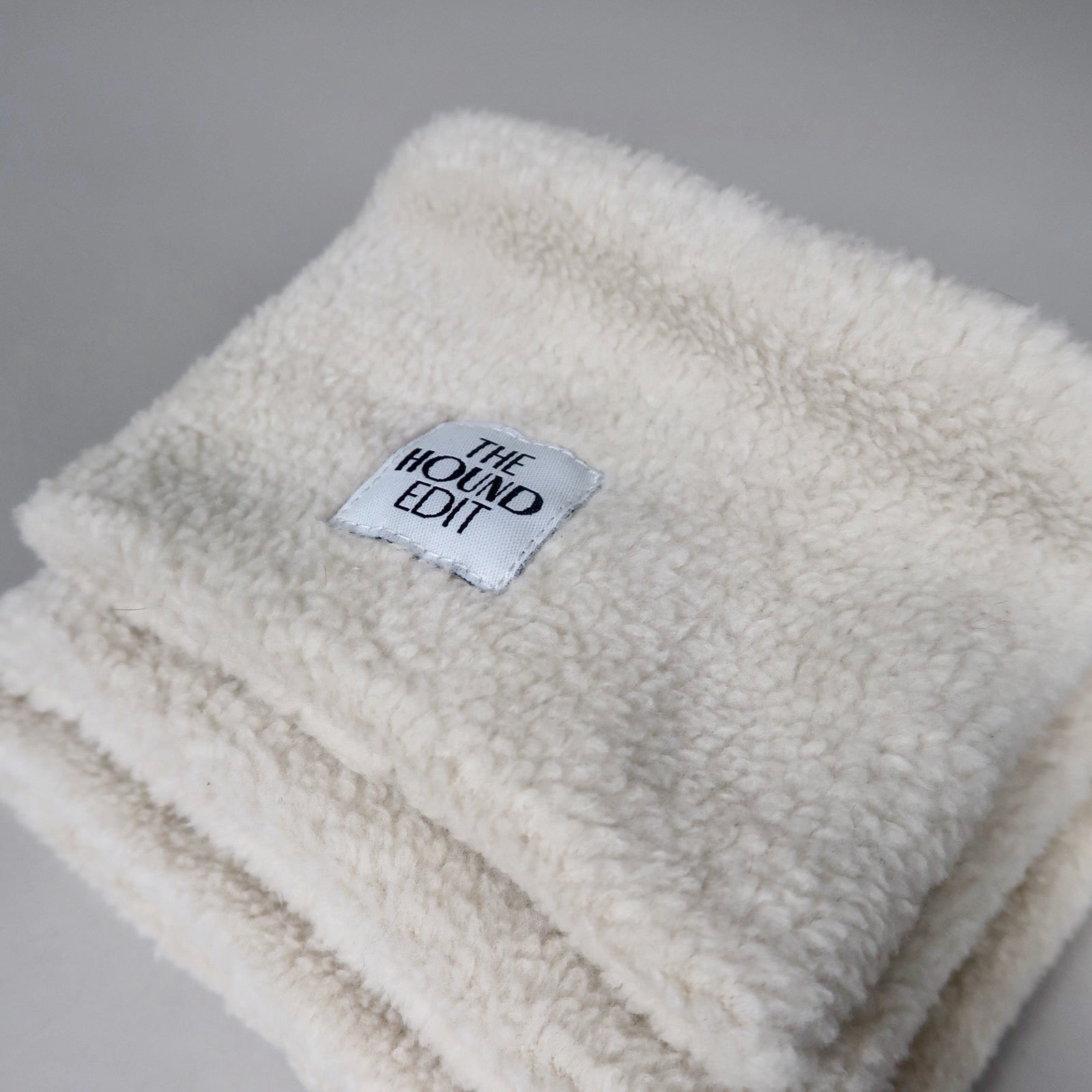 Stacked close-up from above of The Rue, Sighthound 100% cotton snoods, across the three sizes.